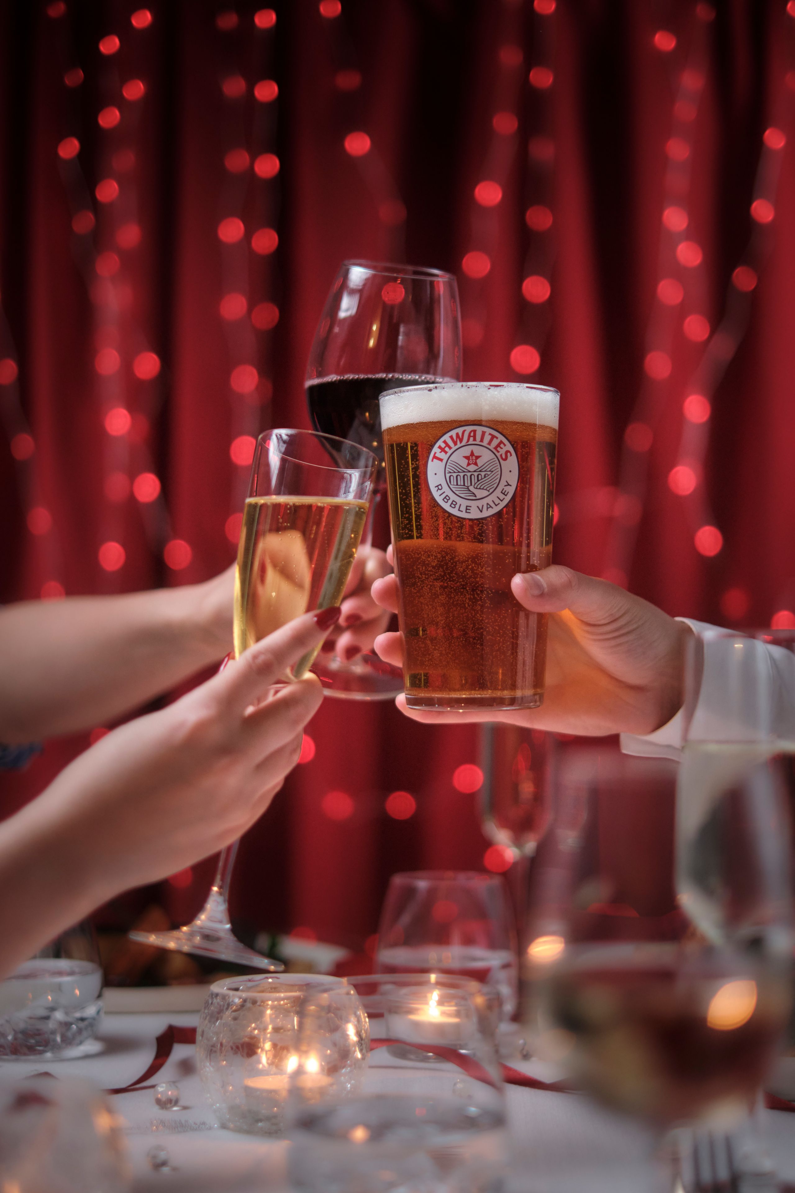 wine, prosecco and thwaites ale glassed clinking