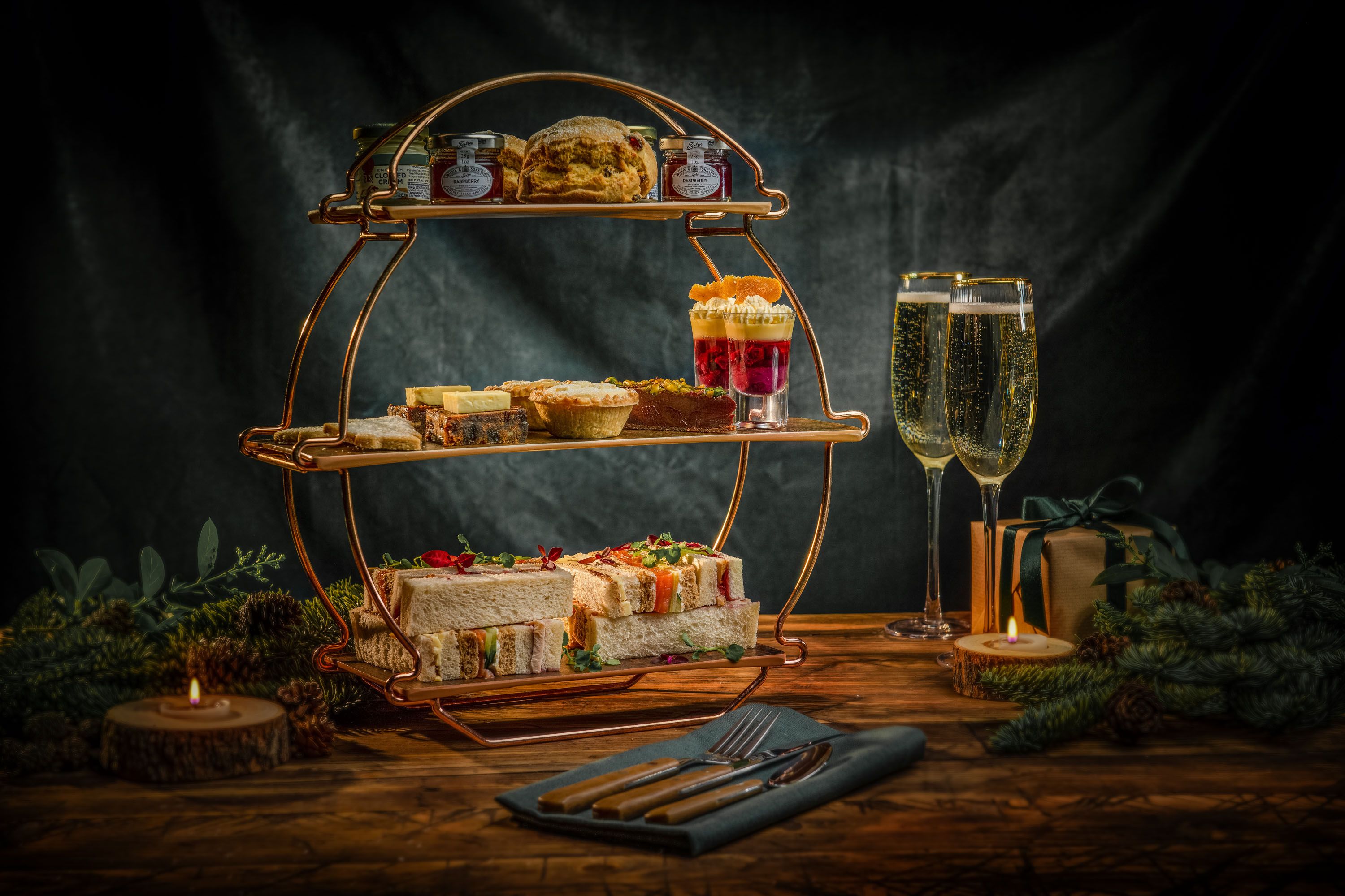 festive afternoon tea with champagne on wooden table